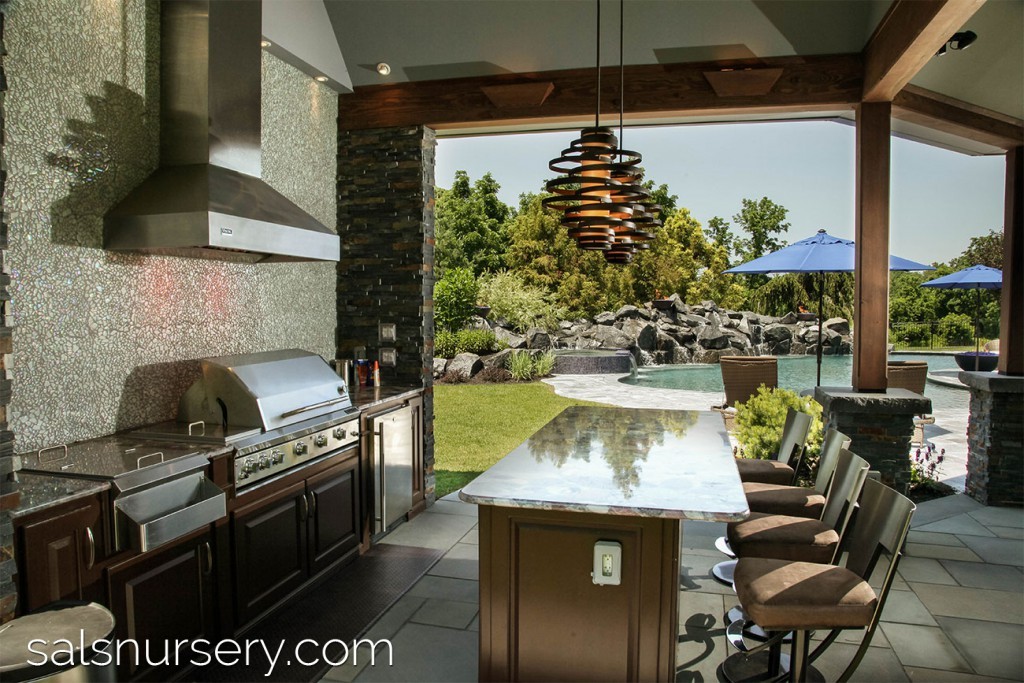Beautiful Outdoor Kitchen with Grill and Bar Seating