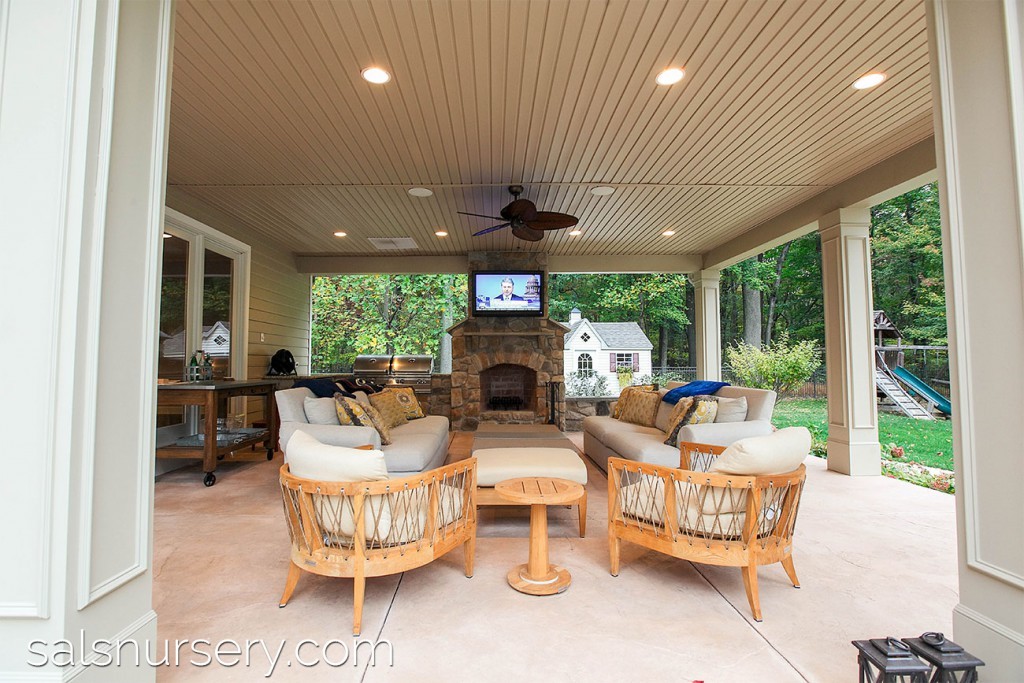 Covered patio with grill, fireplace, TV, and outdoor furniture