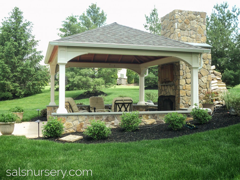 Covered Outdoor Seating Area with Stone Fireplace