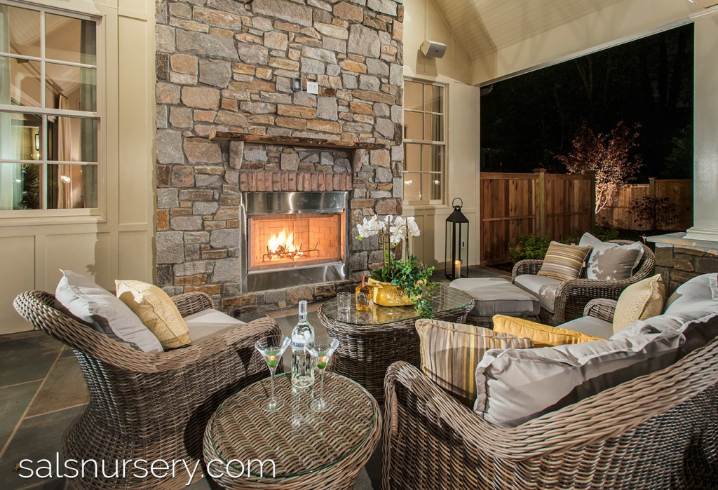 Outdoor Fireplace made of stone and attached to the house
