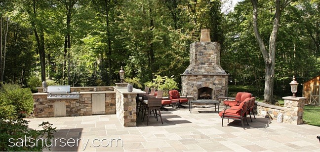 Outdoor Kitchen with seating and outdoor fireplace