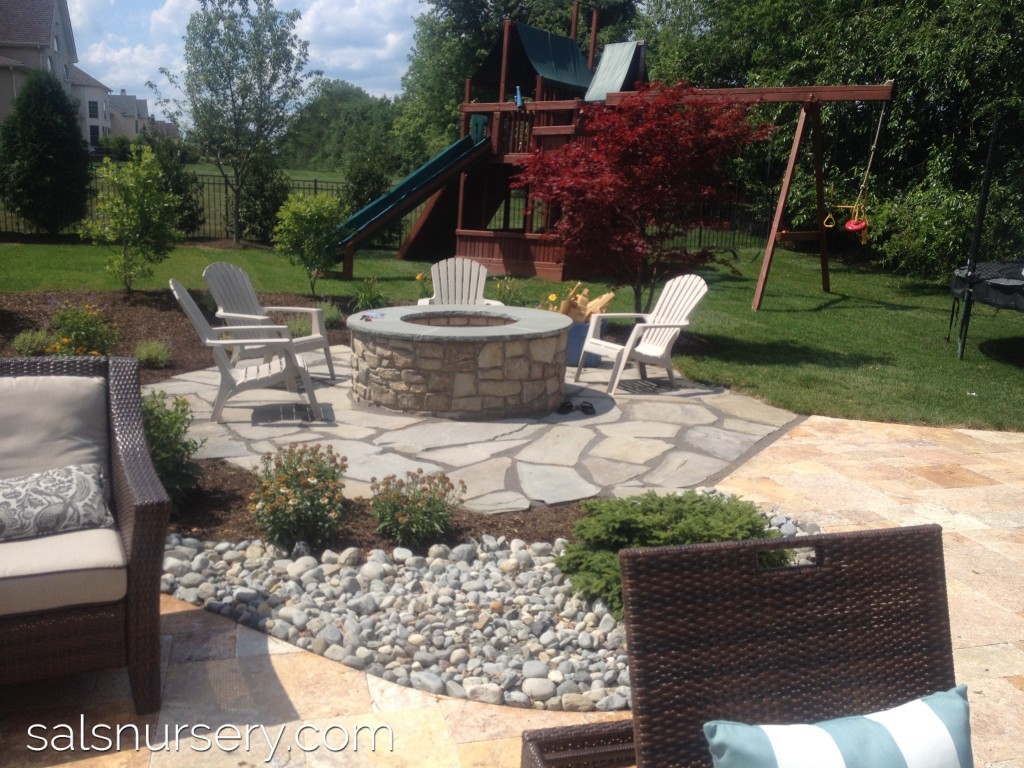 Fire Pit with surrounding patio and chairs